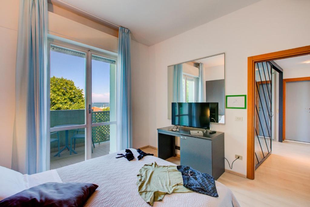 Postel nebo postele na pokoji v ubytování Hotel Ivano