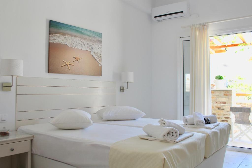 Cama ou camas em um quarto em Aegeo Inn