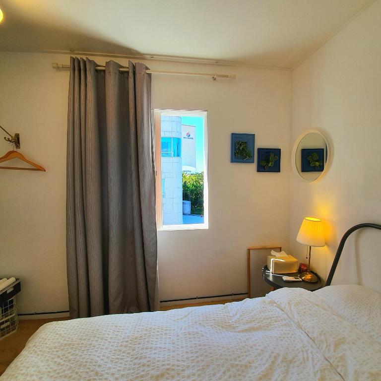 Postel nebo postele na pokoji v ubytování Hannahstay Women Only Guesthouse