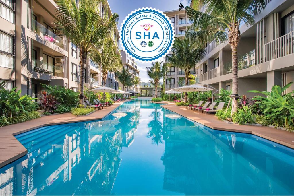 a swimming pool at the sha resort and spa at Diamond Resort Phuket Official Account in Bang Tao Beach