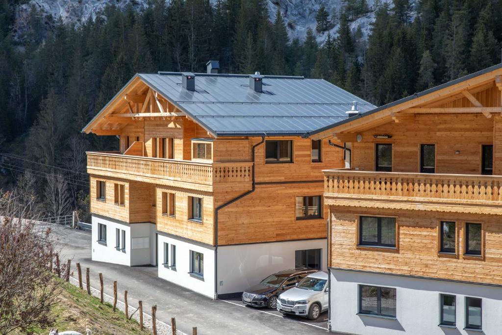 a house with a car parked in front of it at Gleiming apartments in Schladming