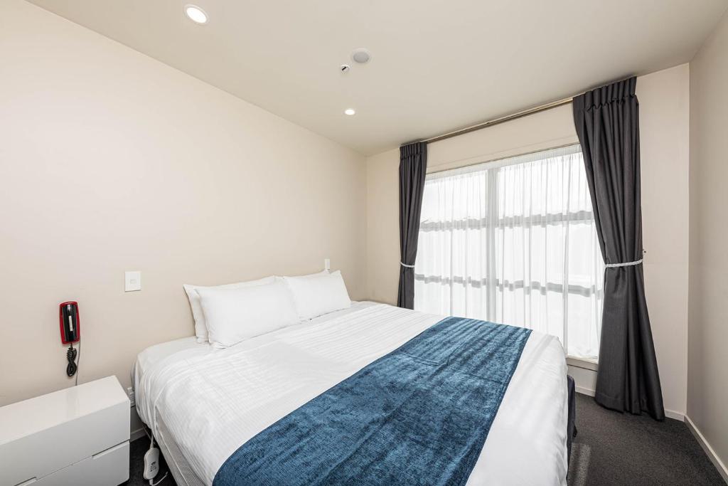 Postel nebo postele na pokoji v ubytování 311 Motel Riccarton