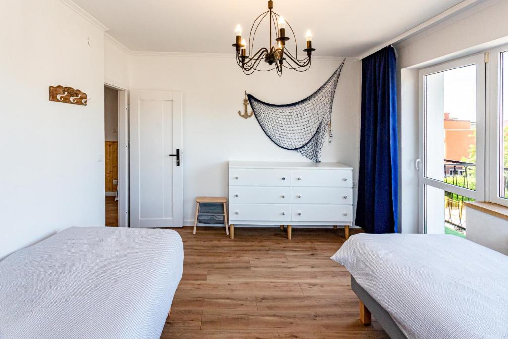 Postel nebo postele na pokoji v ubytování Hostel & Apartments Kołobrzeg