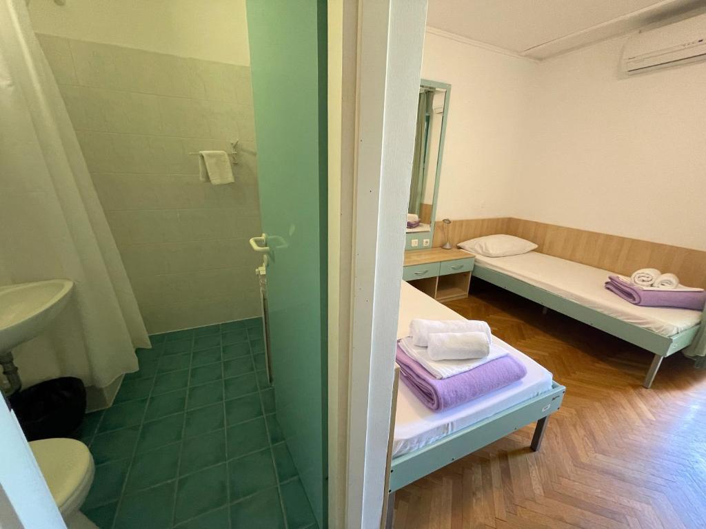 Postelja oz. postelje v sobi nastanitve Hostel Spinut