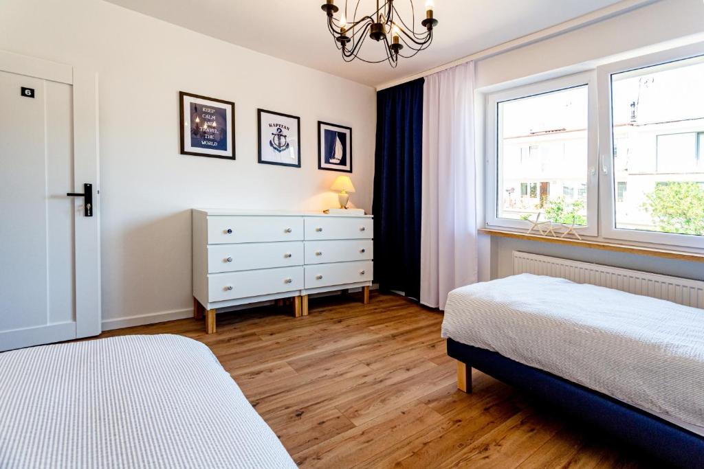 Postel nebo postele na pokoji v ubytování Hostel & Apartments Kołobrzeg