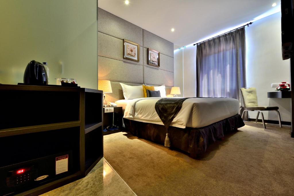 Postel nebo postele na pokoji v ubytování Serela Merdeka by KAGUM Hotels