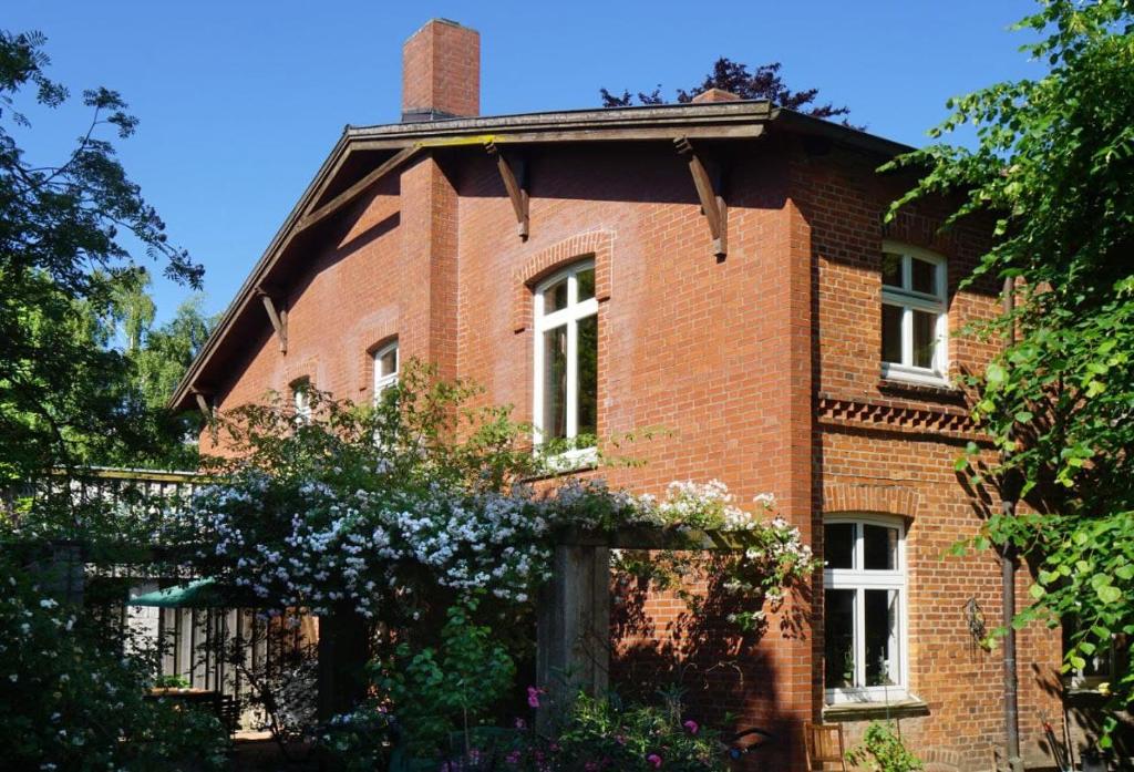 an old red brick house with a chimney on top at Ferienhof Möltgen in Bosau