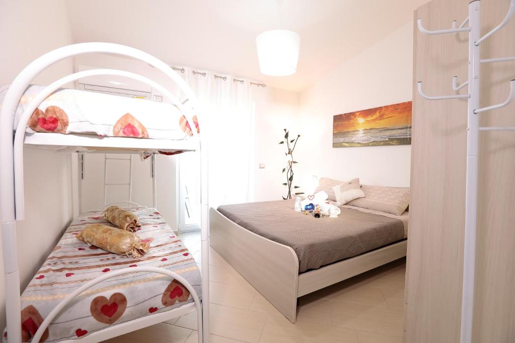Łóżko lub łóżka w pokoju w obiekcie B&B IL TEMPONE