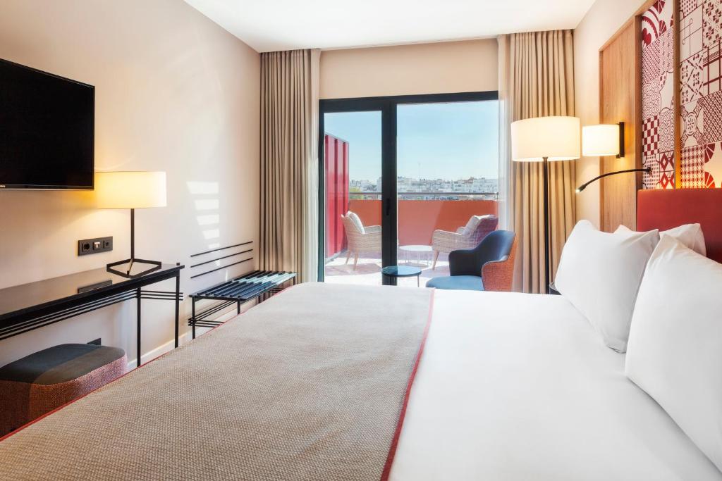 Cama o camas de una habitación en Eurostars Guadalquivir