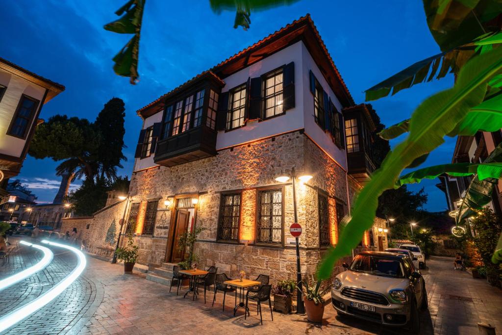 a car parked in front of a building at night at Cedrus Hotel in Antalya