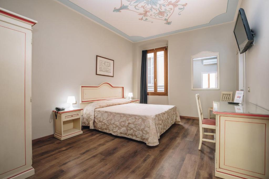 Postel nebo postele na pokoji v ubytování Hotel Astoria