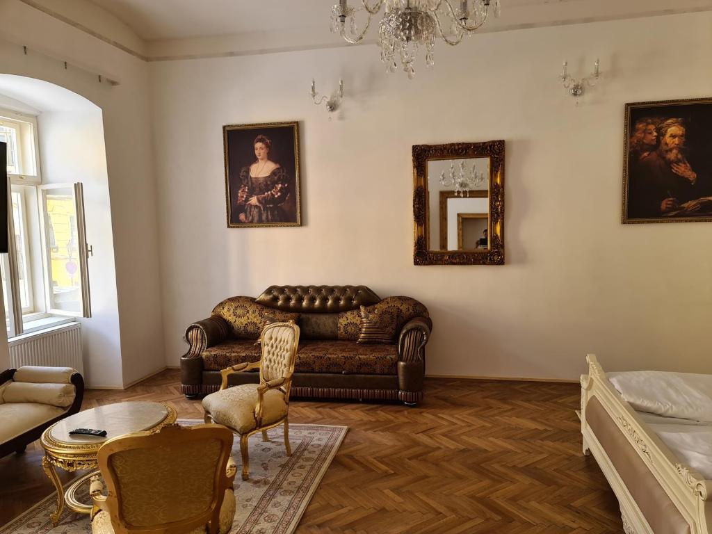 a living room with a couch and a table at Apartmány Svätá Barborka in Banská Štiavnica