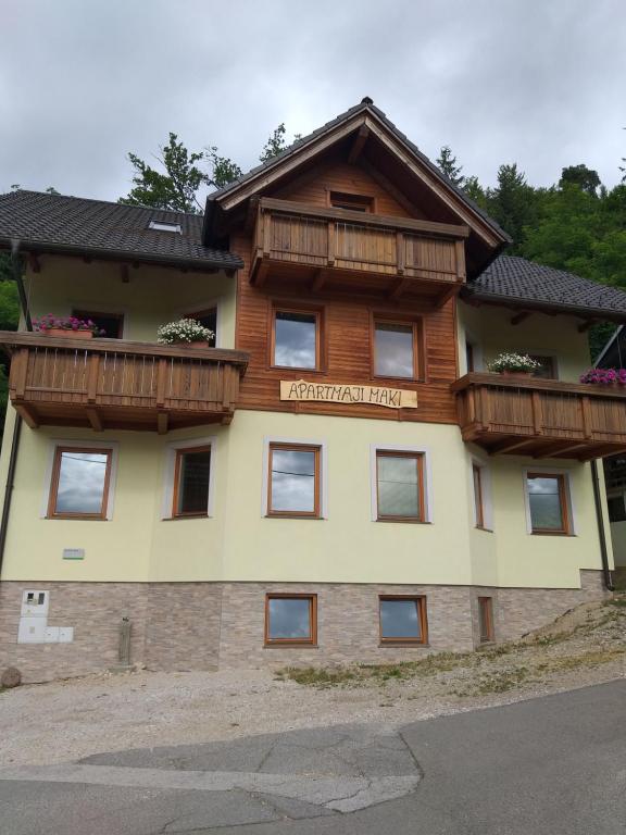 a building with balconies on top of it at Apartmaji Maki in Bled