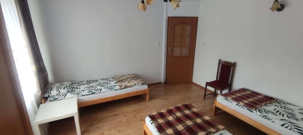 Postel nebo postele na pokoji v ubytování Pokoje gościnne u Sławka