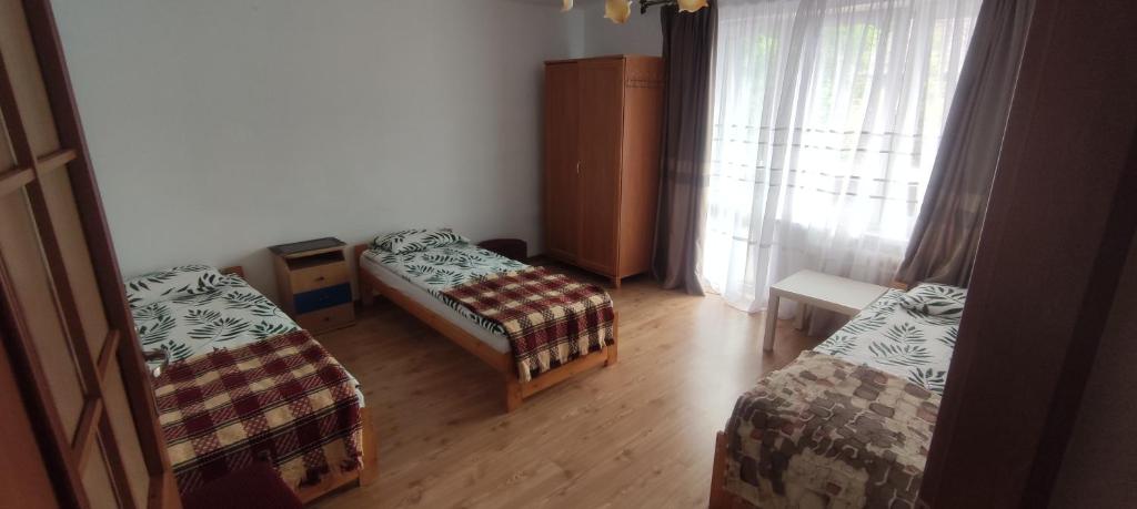 Postel nebo postele na pokoji v ubytování Pokoje gościnne u Sławka