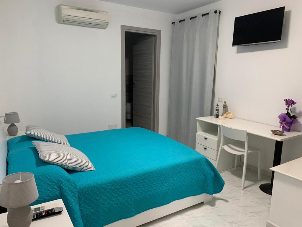 Televízia a/alebo spoločenská miestnosť v ubytovaní B&B Bentu de Mari