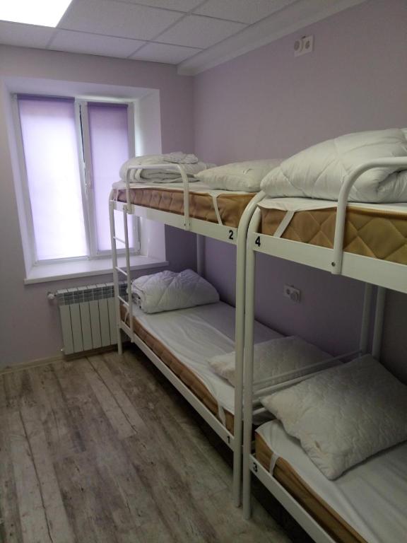 Postel nebo postele na pokoji v ubytování Женский Hostel Dvor