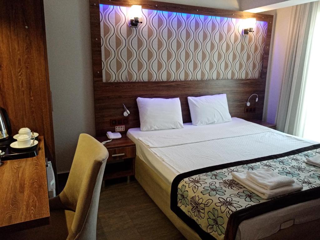 Postel nebo postele na pokoji v ubytování Dolphin Apart Hotel