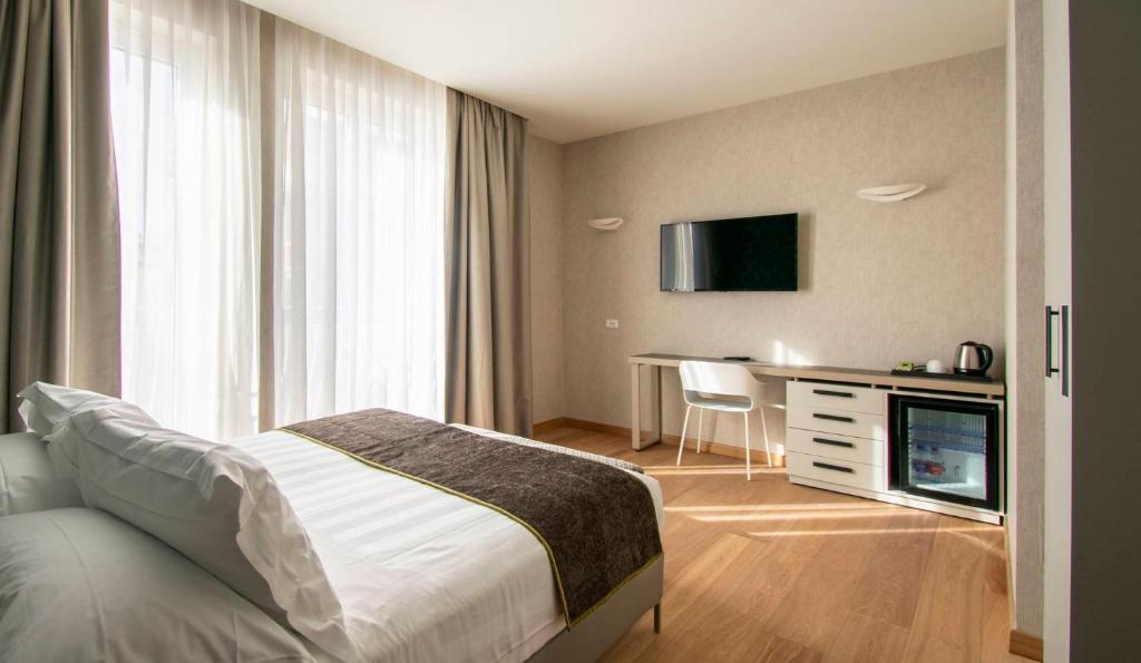 Postel nebo postele na pokoji v ubytování Hotel Medusa