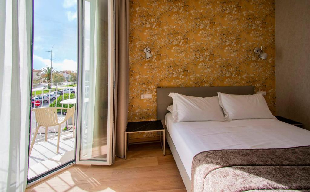 Postel nebo postele na pokoji v ubytování Hotel Medusa