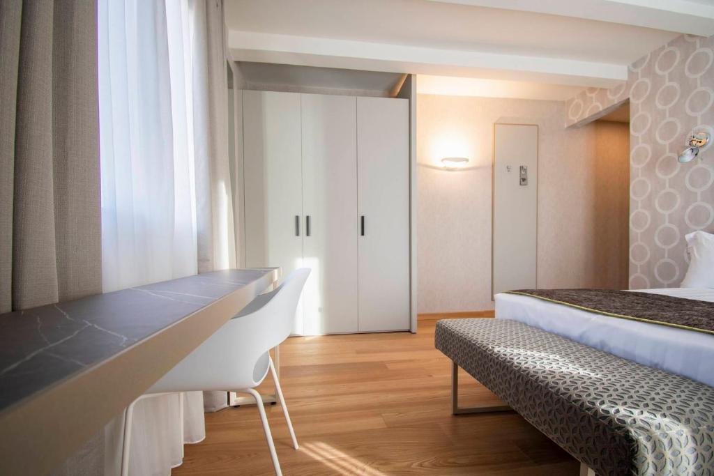 Postel nebo postele na pokoji v ubytování Hotel Medusa