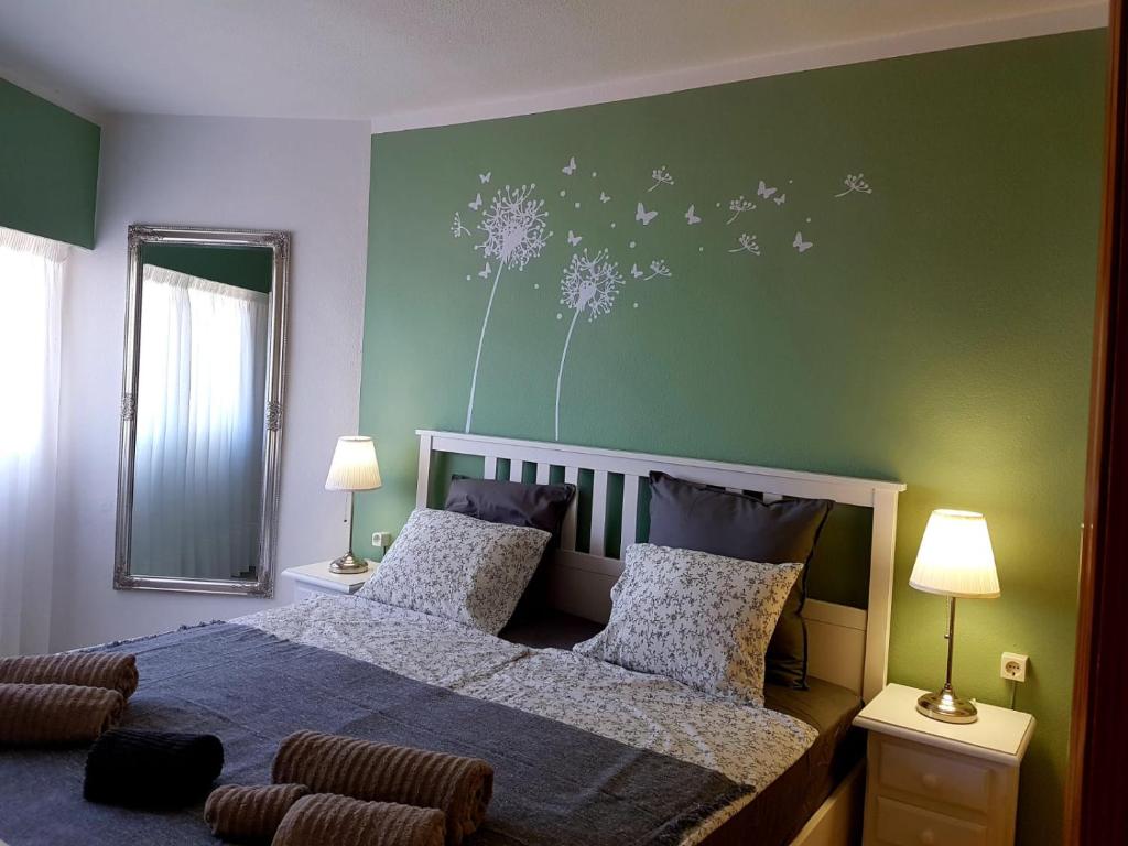 Postel nebo postele na pokoji v ubytování Apartamentos Tamarindos