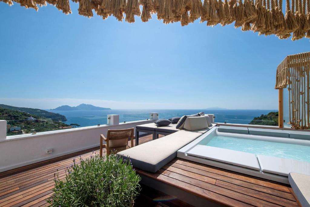 a villa with a swimming pool on a deck at Casa Mariavittoria in Massa Lubrense