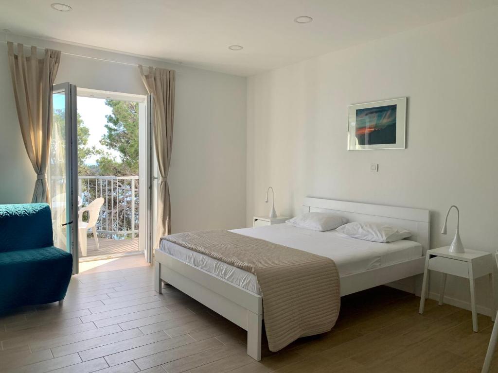 Postel nebo postele na pokoji v ubytování Apartments Kaldana