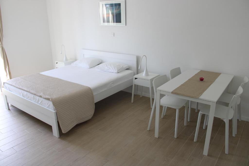 Postel nebo postele na pokoji v ubytování Apartments Kaldana