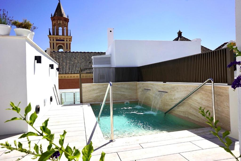 a swimming pool on the roof of a building at Hotel Amadeus Sevilla in Seville