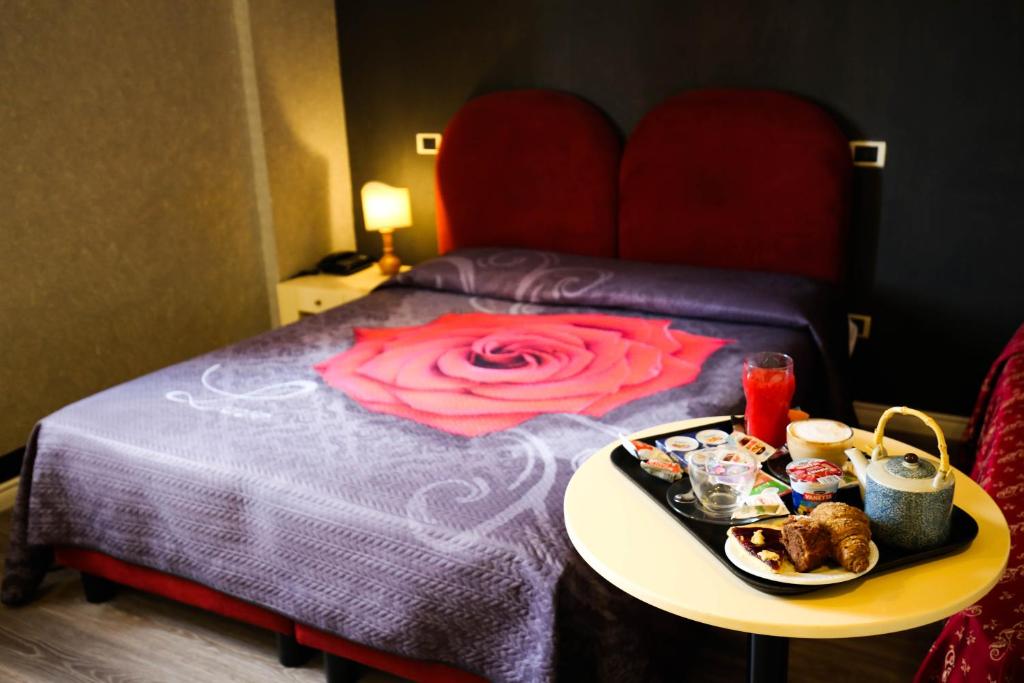 Postel nebo postele na pokoji v ubytování Hotel Benedetti