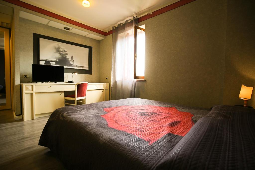 Postel nebo postele na pokoji v ubytování Hotel Benedetti