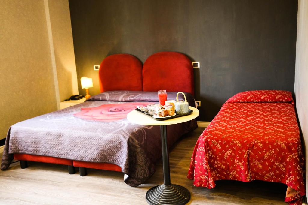 Postel nebo postele na pokoji v ubytování Hotel Benedetti