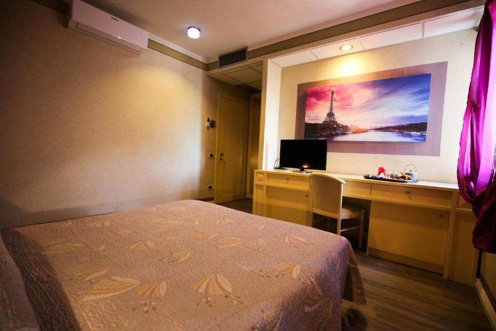 Postel nebo postele na pokoji v ubytování Hotel Benedetti