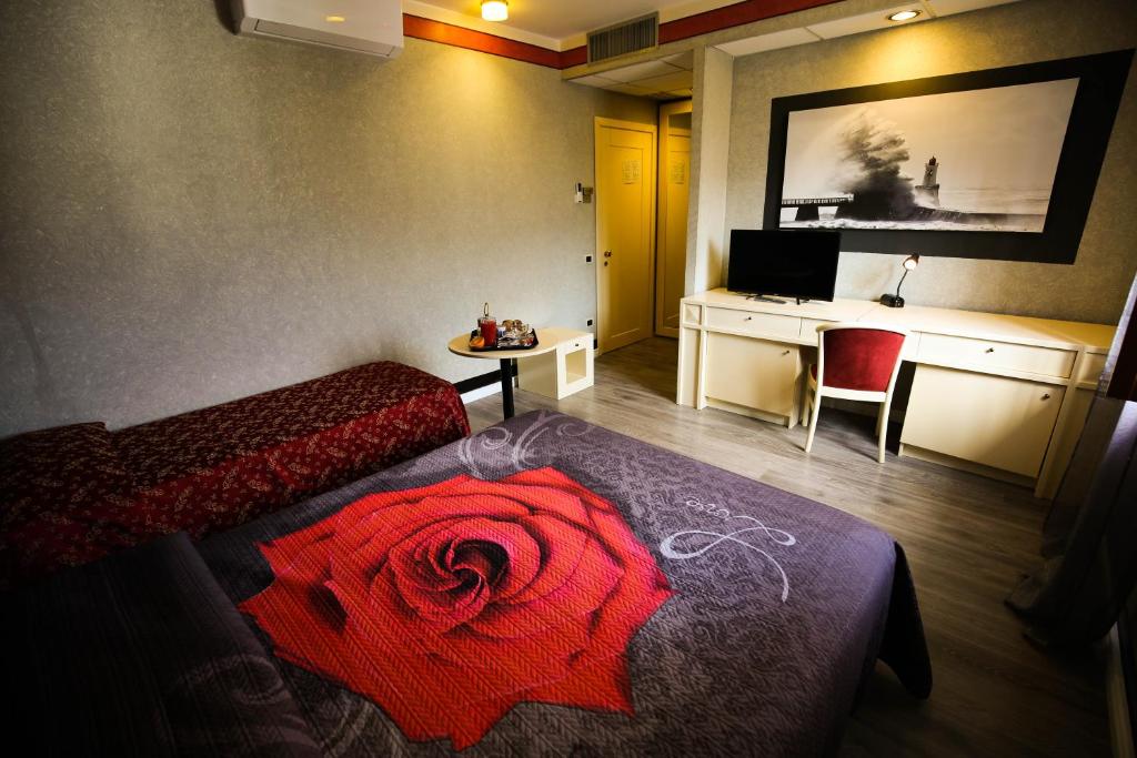 Postel nebo postele na pokoji v ubytování Hotel Benedetti
