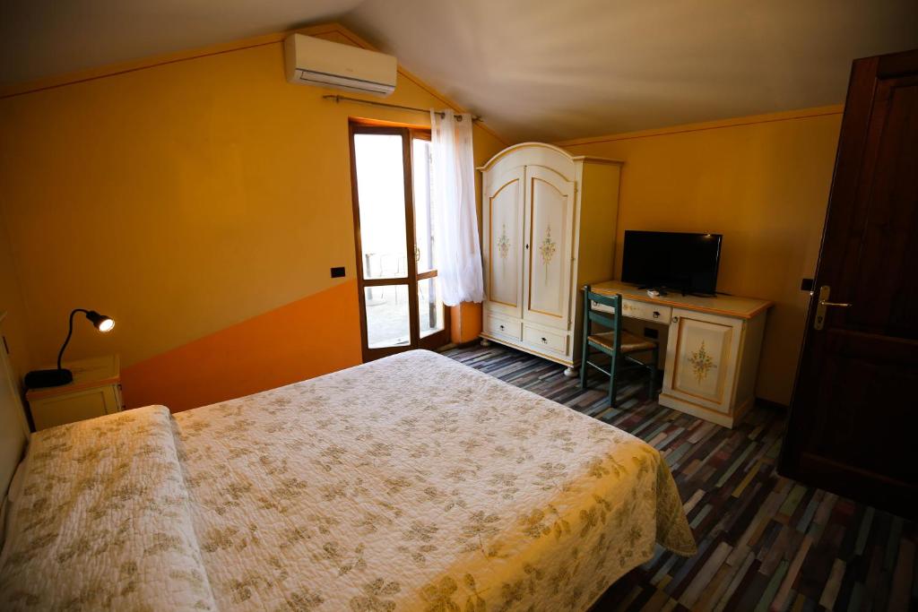 Postel nebo postele na pokoji v ubytování Hotel Benedetti