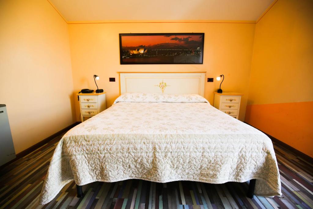 Postel nebo postele na pokoji v ubytování Hotel Benedetti