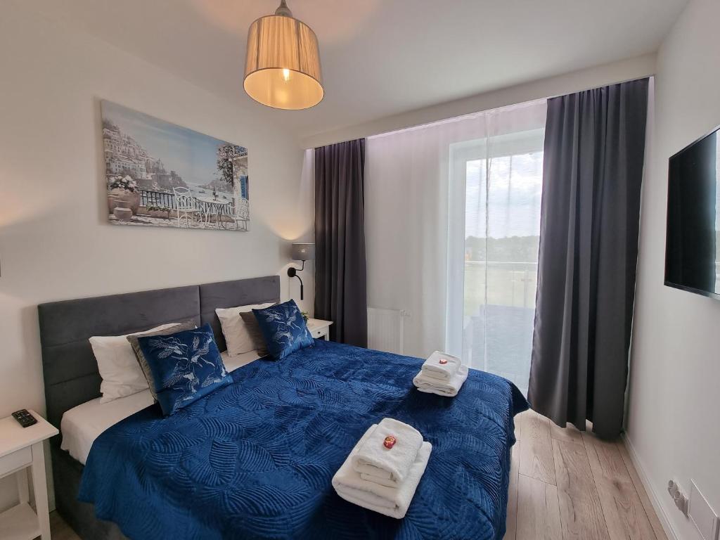 Posteľ alebo postele v izbe v ubytovaní Apartamenty Na Fali w Gąskach - 365PAM