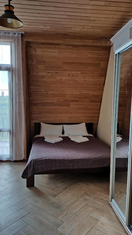 Postel nebo postele na pokoji v ubytování Dom Fedorovyh