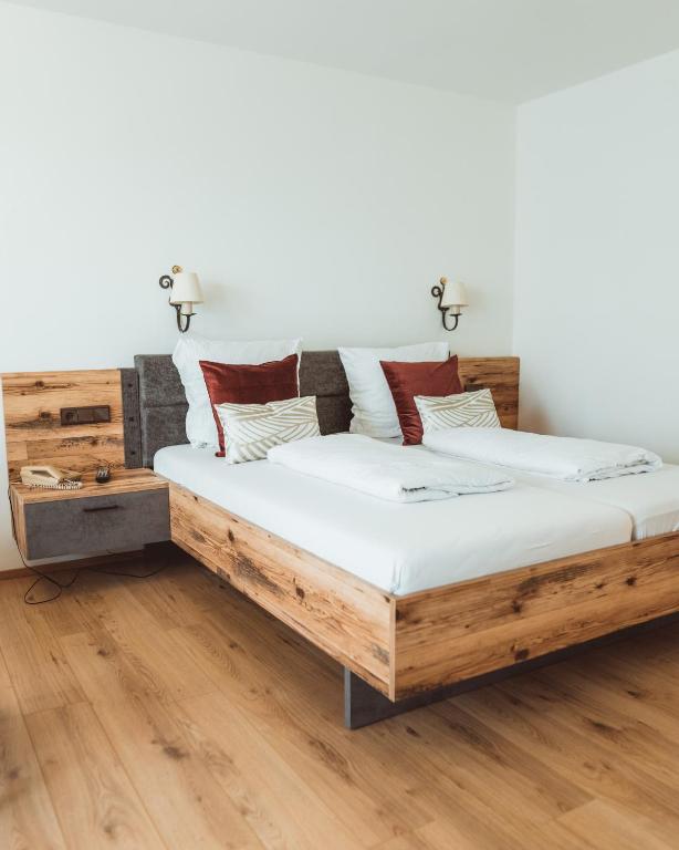 Postel nebo postele na pokoji v ubytování Hotel Berghof Graml