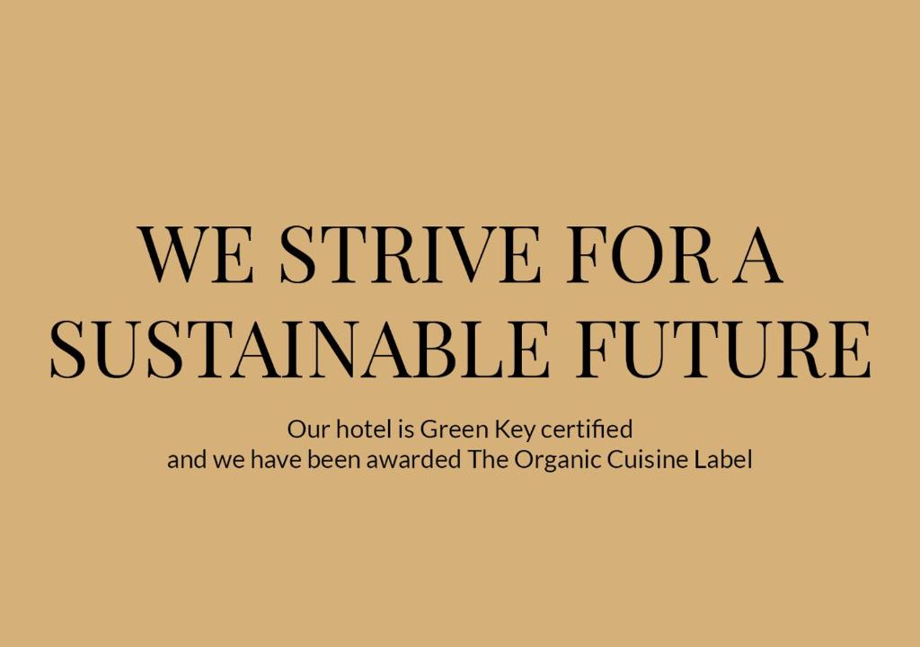 a sign that says we strive for a sustainable future at Aalborg Airport Hotel in Aalborg