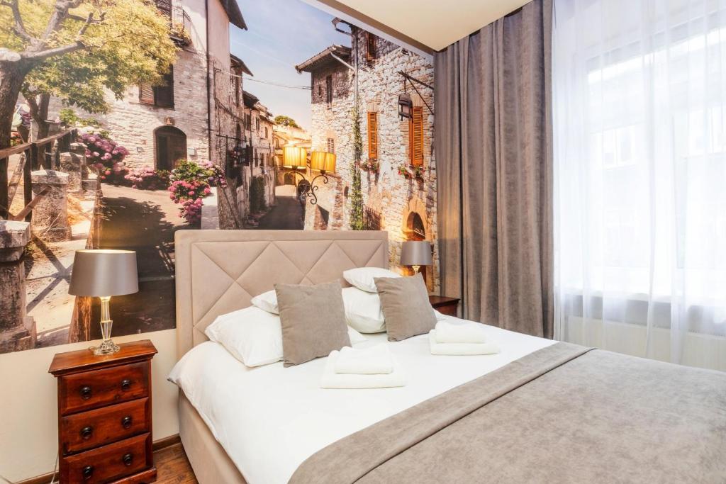 Posteľ alebo postele v izbe v ubytovaní Hotel Wenecki