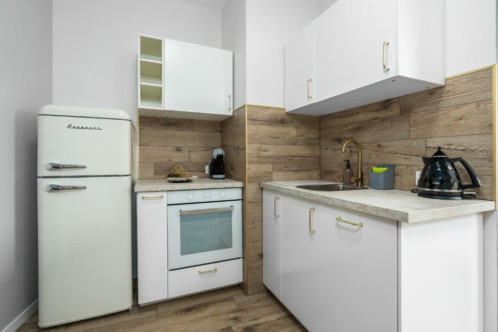 Kuchyňa alebo kuchynka v ubytovaní Apartments City View Garbary by Noclegi Renters