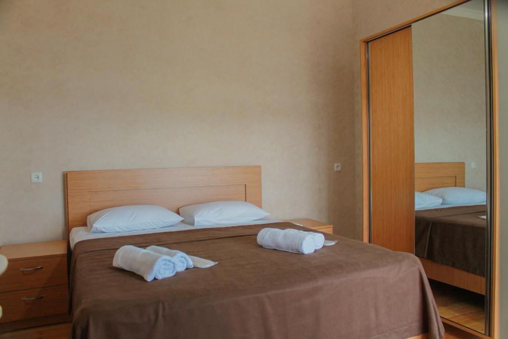 Llit o llits en una habitació de Guest House Maradona