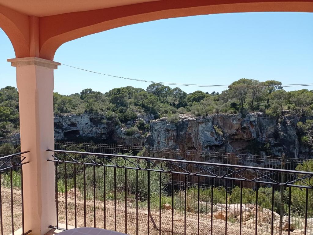 a balcony with a view of a mountain at The Torrent's Observer Holiday Home ( Cala Pi ). Smart Tv. Netflix. Free Wifi in Cala Pi