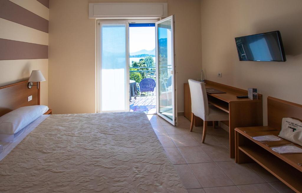 Postel nebo postele na pokoji v ubytování Hotel Alpi