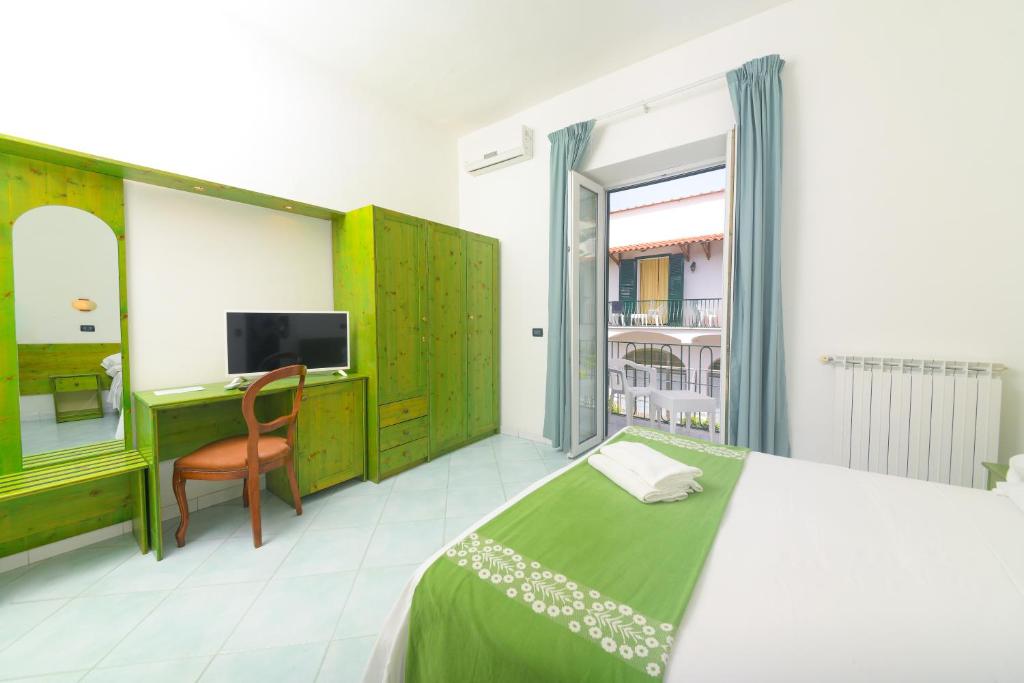 Postel nebo postele na pokoji v ubytování Hotel Pineta