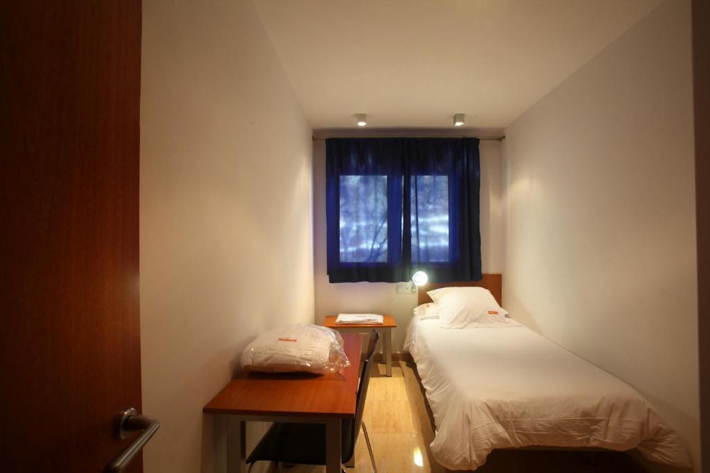 Postel nebo postele na pokoji v ubytování Apartaments Turístics Prat de Les Mines
