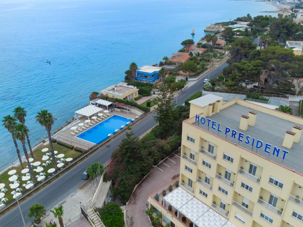 an aerial view of a hotel with the ocean at Hotel President Sea Palace in Noto Marina