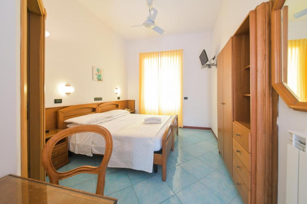 Postel nebo postele na pokoji v ubytování Hotel Pineta